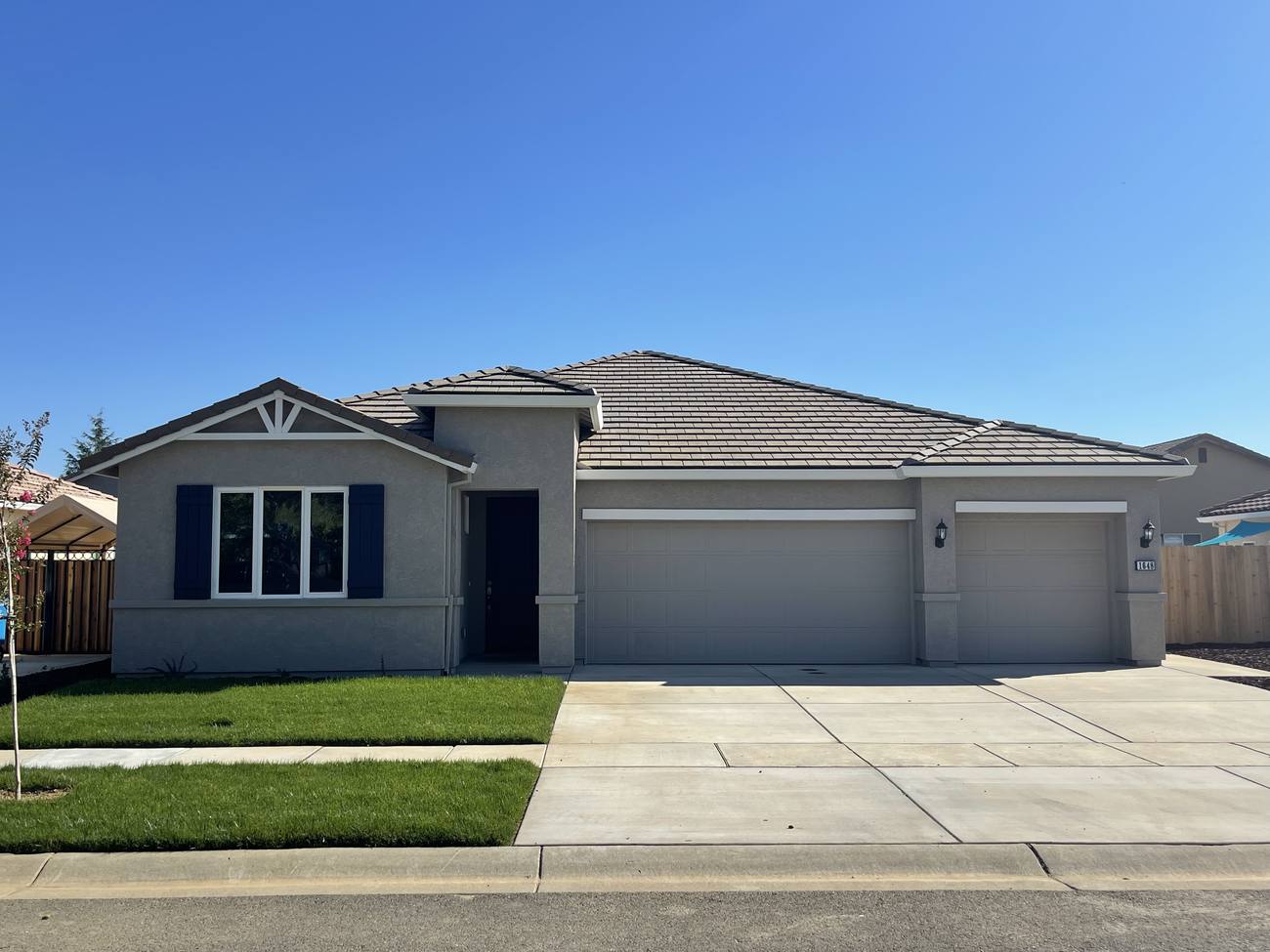 Completed Oak Grove Estates home: single-story, three-car garage, tile roof